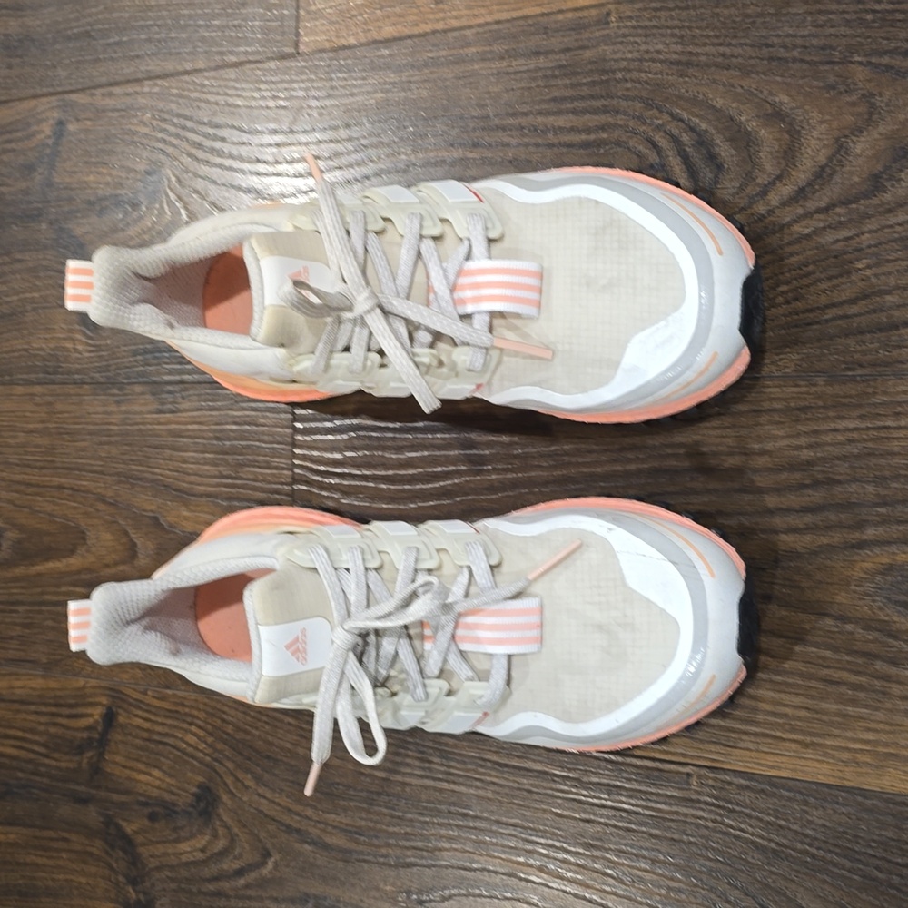 Women's like new Adidas Ultraboost size 8.5 Cream and Coral Pink color.